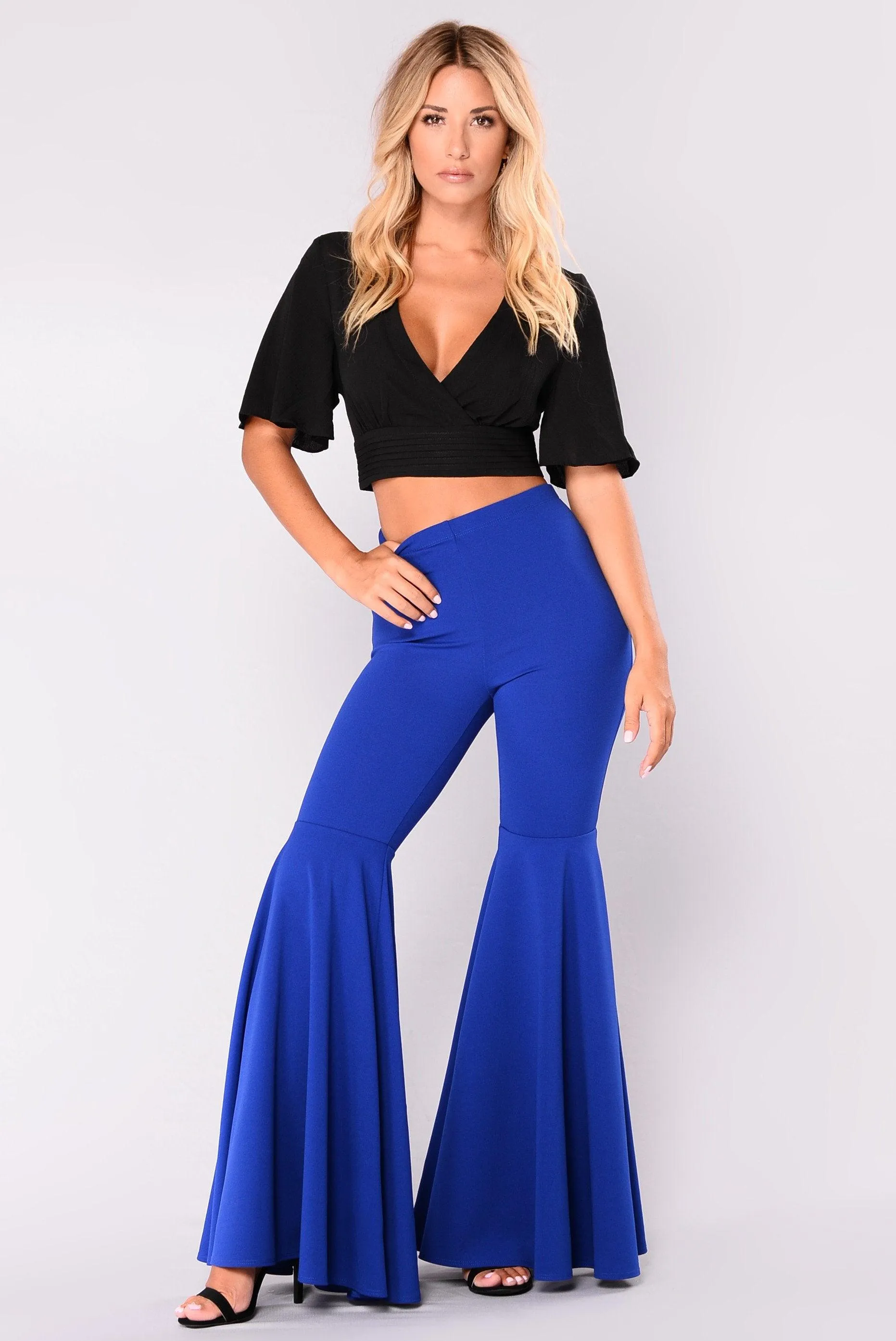 HIGH RUFFLED FITTED FLARE PANTS